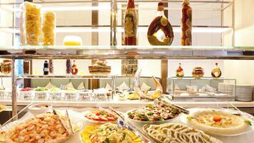 A buffet with various food items and condiments.