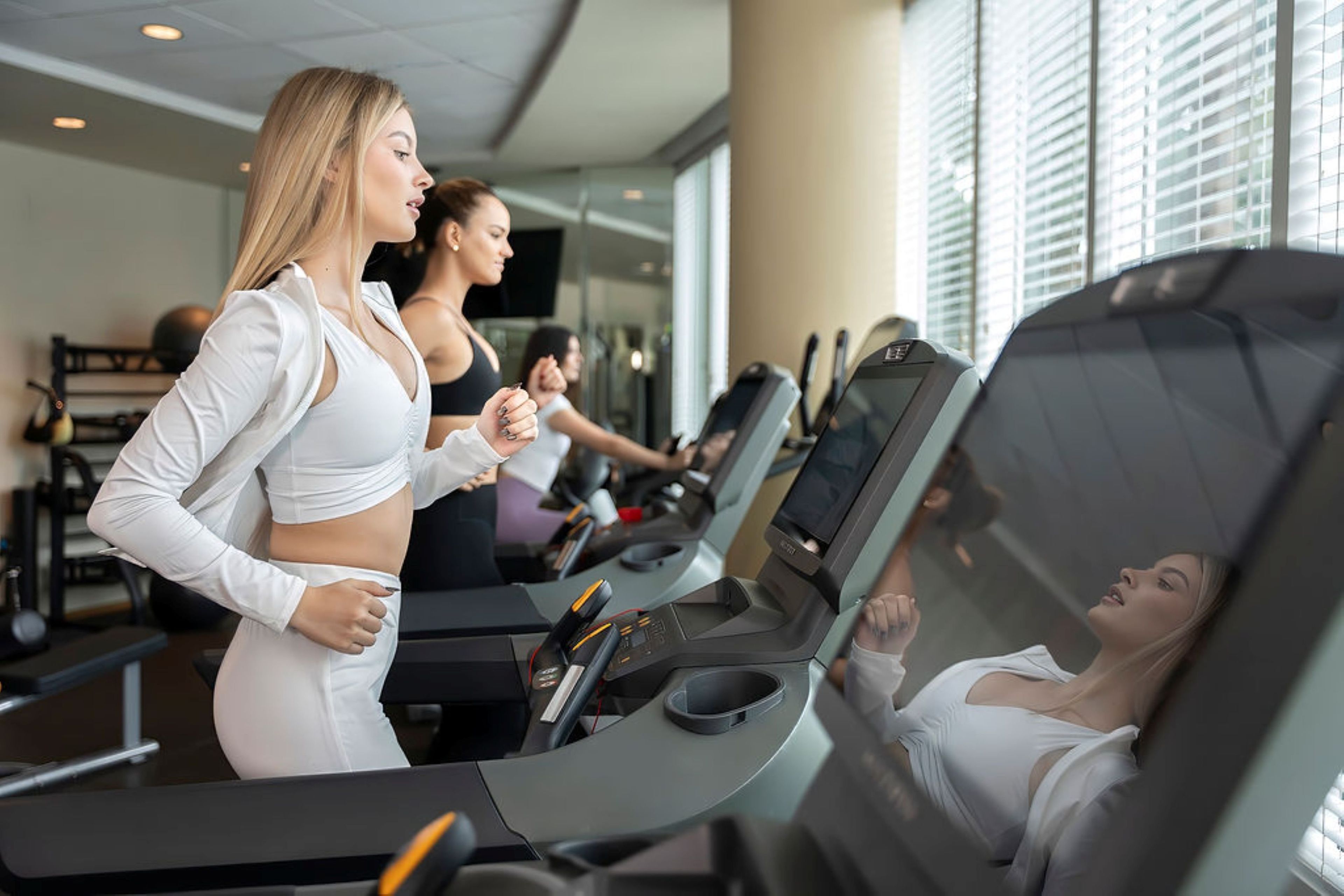 A gym with treadmills and exercise equipment.