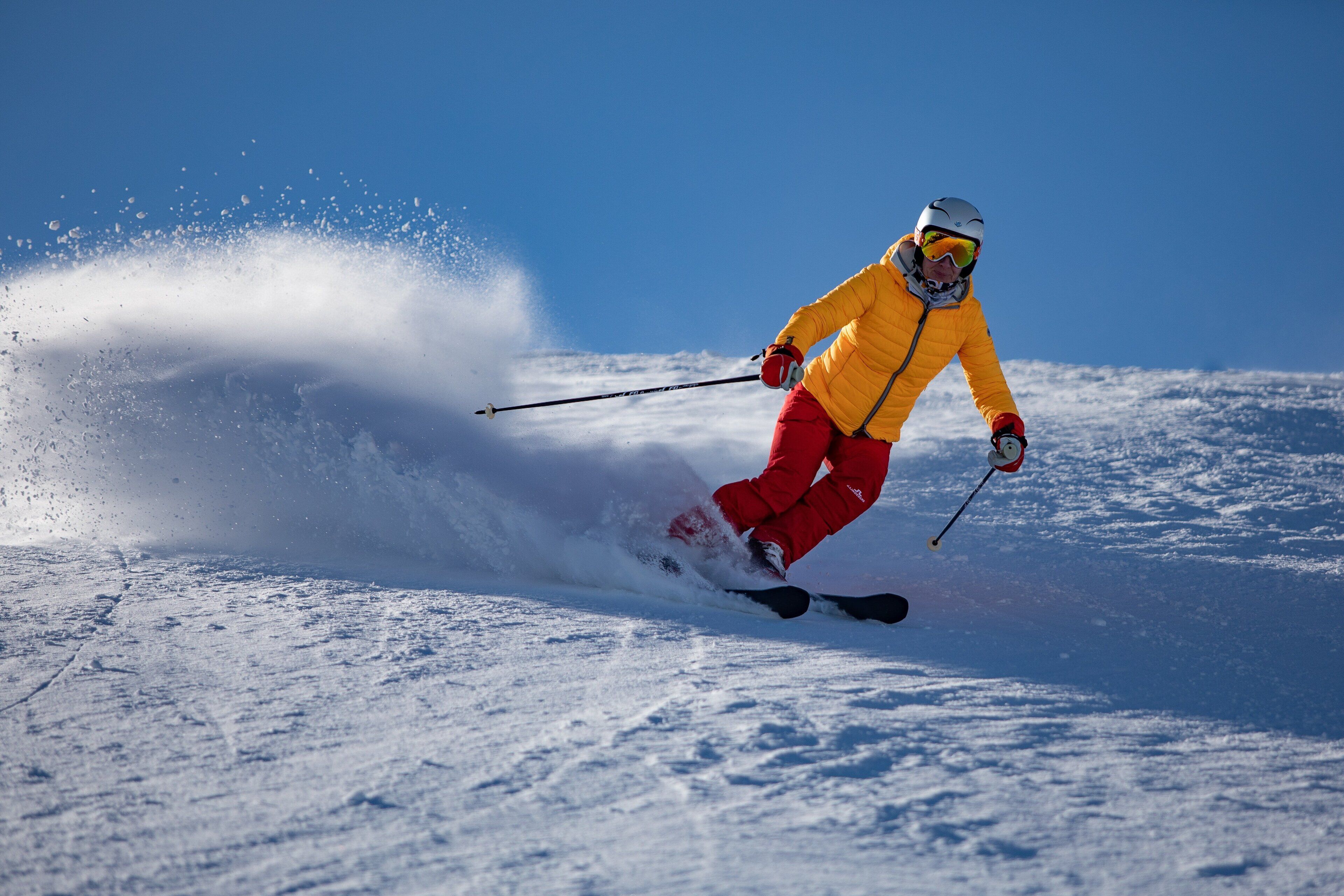 A person skiing on a snowy slope.