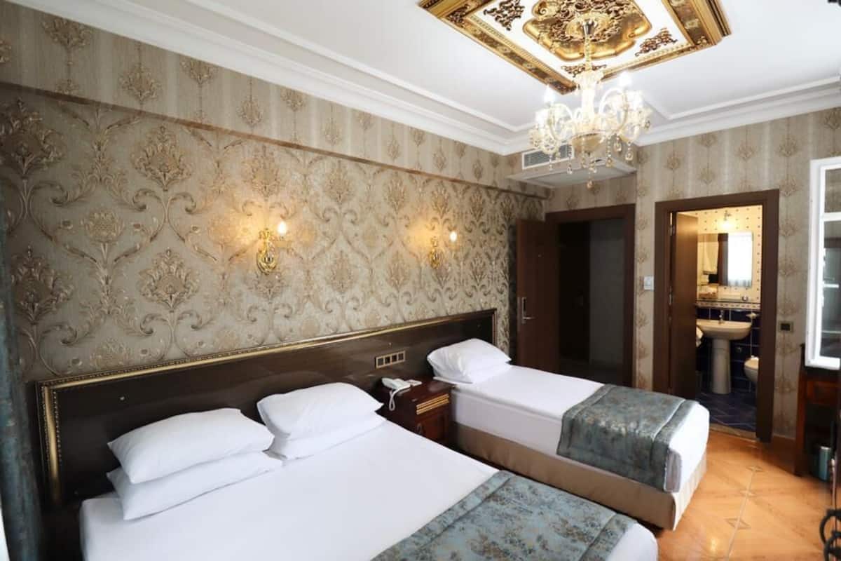 Chambre Triple Deluxe | Literie de qualité supérieure, minibar, coffres-forts dans les chambres