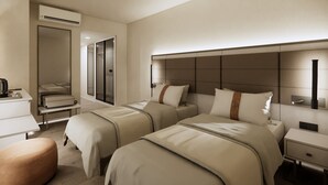 Una habitación de hotel con dos camas, un escritorio, una silla y un equipo de aire acondicionado.