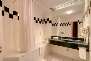 Designer toiletries, hair dryer, towels