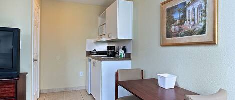 Fridge, microwave, stovetop, coffee/tea maker