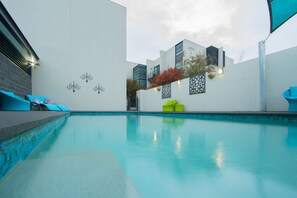 Outdoor pool, pool umbrellas, sun loungers