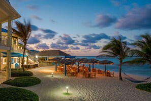 On the beach, white sand, sun loungers, beach towels