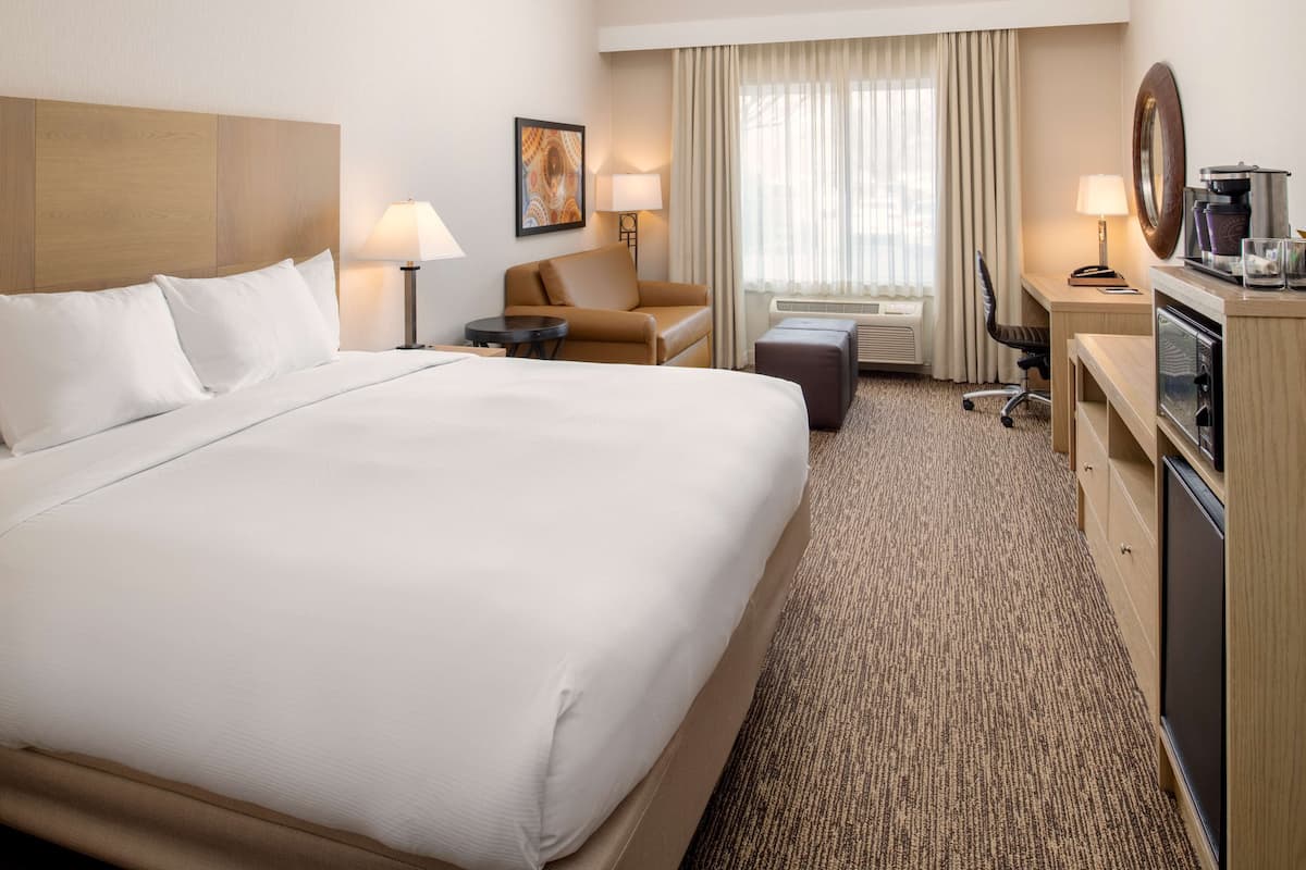 Hypo-allergenic bedding, down duvets, pillow-top beds, in-room safe