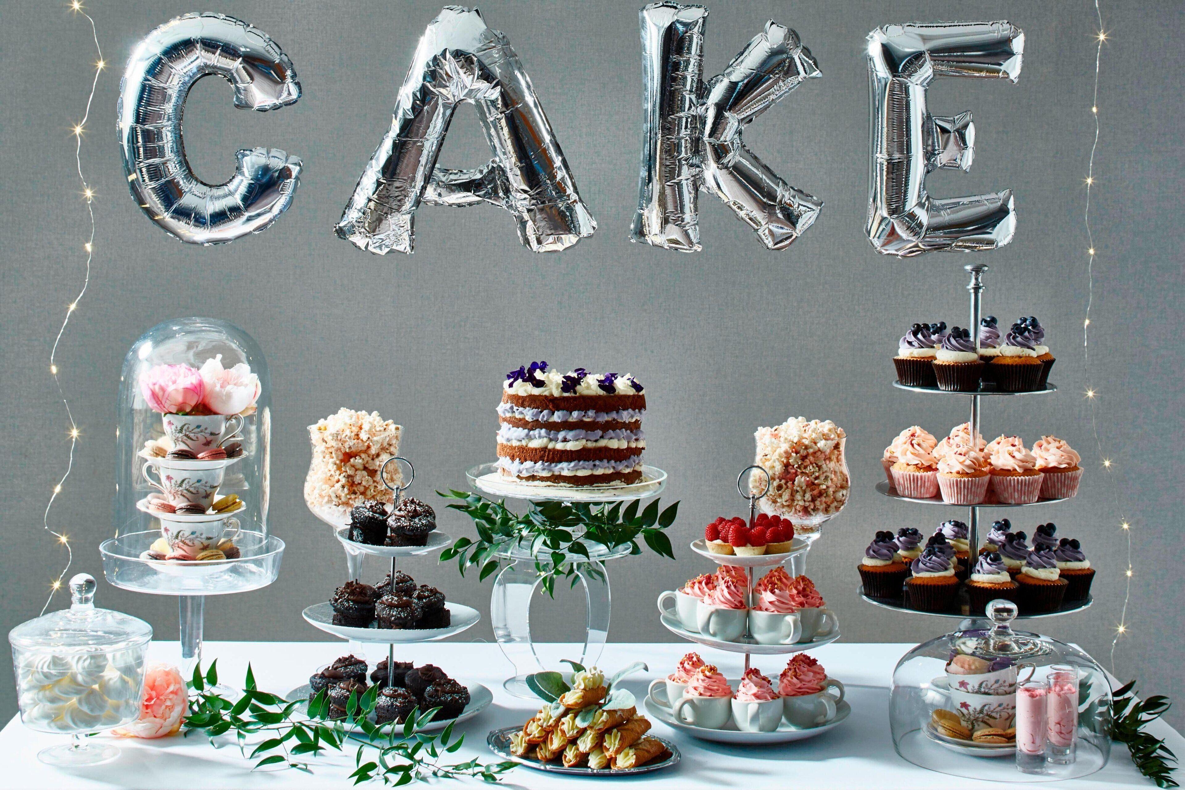 A dessert display with various cakes and pastries.