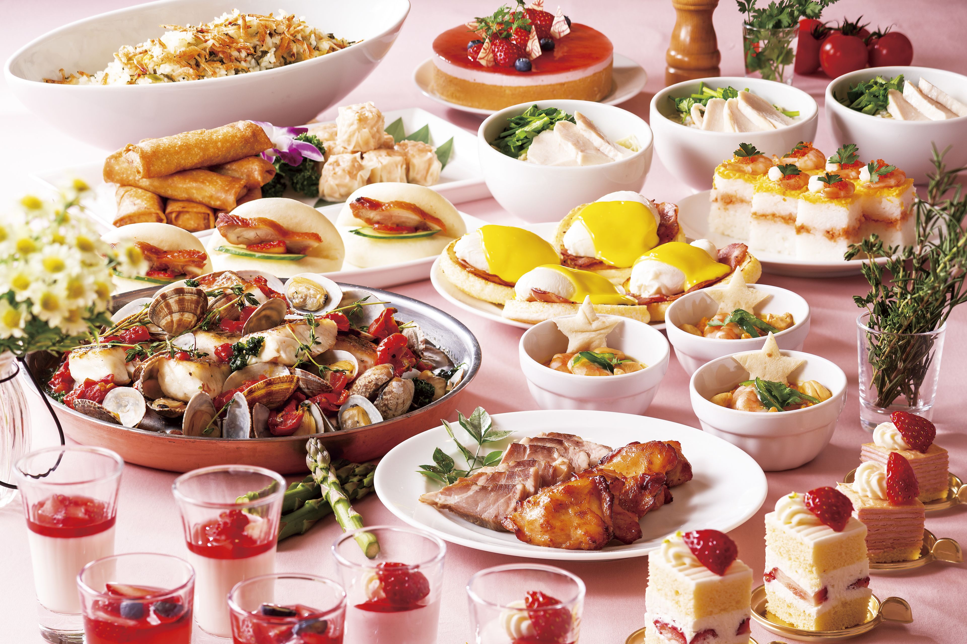 A variety of dishes including seafood, salads, and desserts on a table.