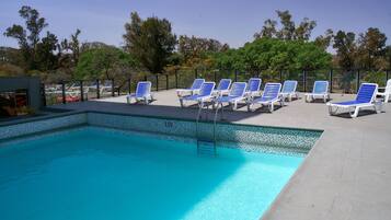Outdoor pool, pool umbrellas, pool loungers