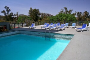 Outdoor pool, pool umbrellas, sun loungers