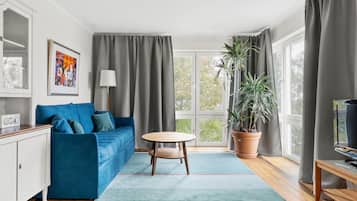 Premium bedding, laptop workspace, blackout drapes, soundproofing