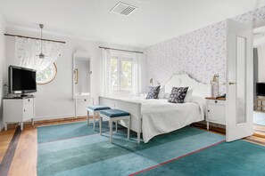 Premium bedding, laptop workspace, blackout curtains, soundproofing