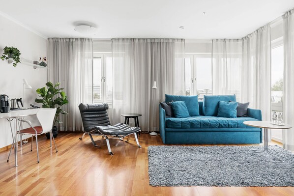 Premium bedding, laptop workspace, blackout curtains, soundproofing