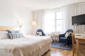 Premium bedding, laptop workspace, blackout curtains, soundproofing