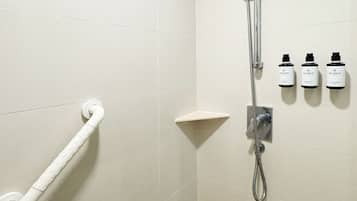 Shower, hair dryer, slippers, towels