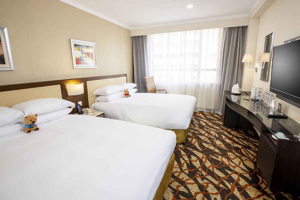 Deluxe Family Room | In-room safe, desk, blackout curtains, iron/ironing board