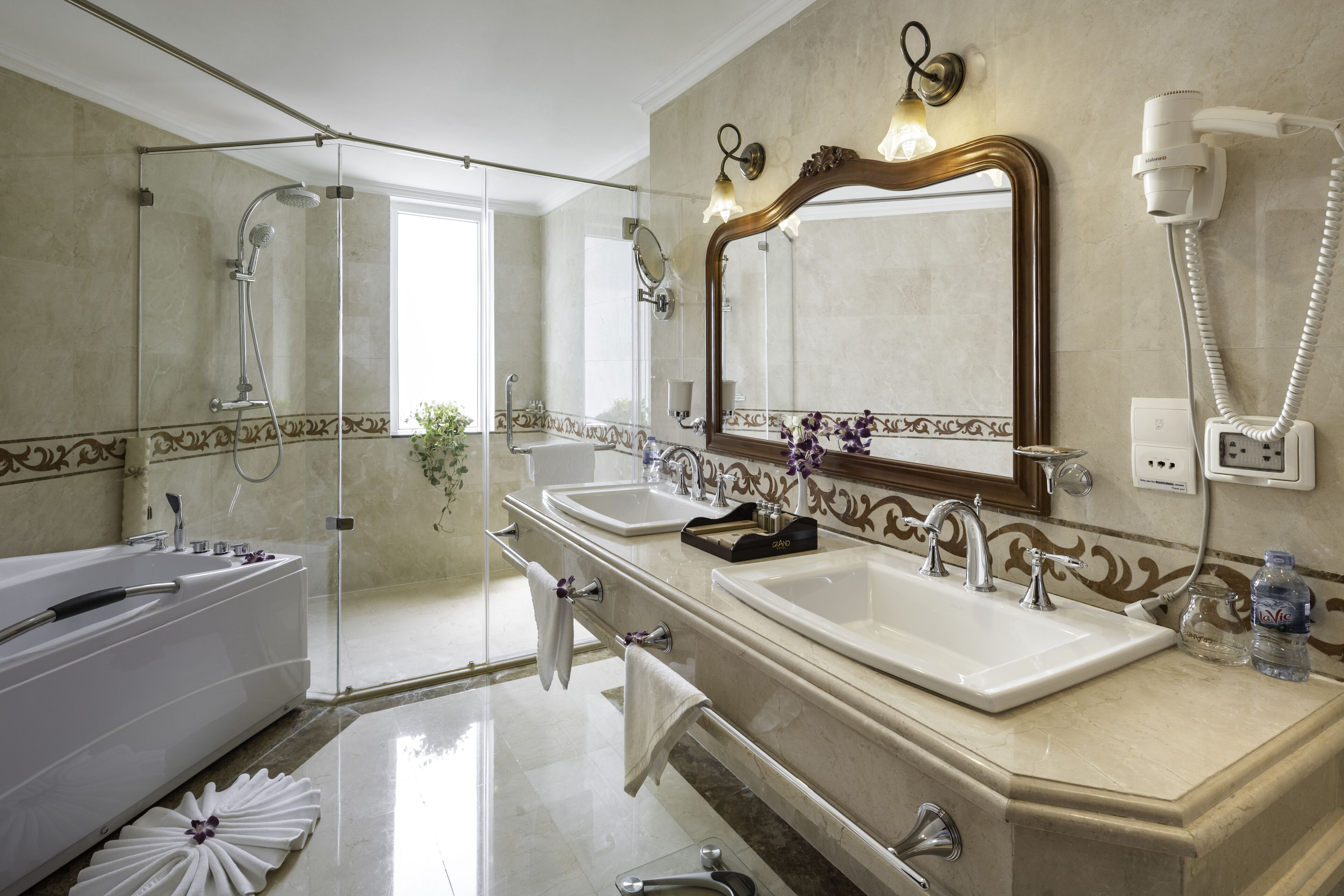 royal suite | bathroom | separate bathtub and shower, rainfall showerhead, free toiletries