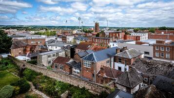 A historic town with a mix of traditional and modern buildings, including a prominent church tower.