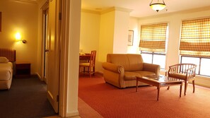 Three Bedroom Apartment | Living area | 21-inch TV with satellite channels