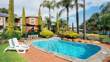 Outdoor pool, open 7:00 AM to 9:00 PM, pool loungers