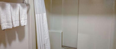 Combined shower/tub, hair dryer, towels, soap