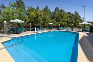 Seasonal outdoor pool, open 10:00 AM to 9:00 PM, pool umbrellas