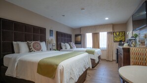 A hotel room with two beds, a desk, a chair, and a TV. - Hotel Baja San Diego - A Boutique Hotel (San Ysidro)