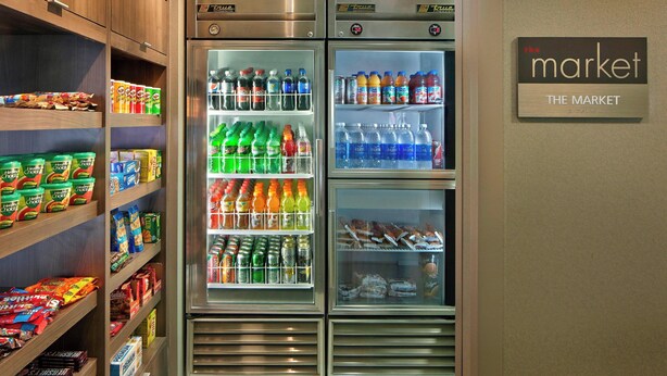 A vending machine stocked with snacks and drinks, labeled "The Market." - Residence Inn by Marriott Hartford Downtown (Hartford)