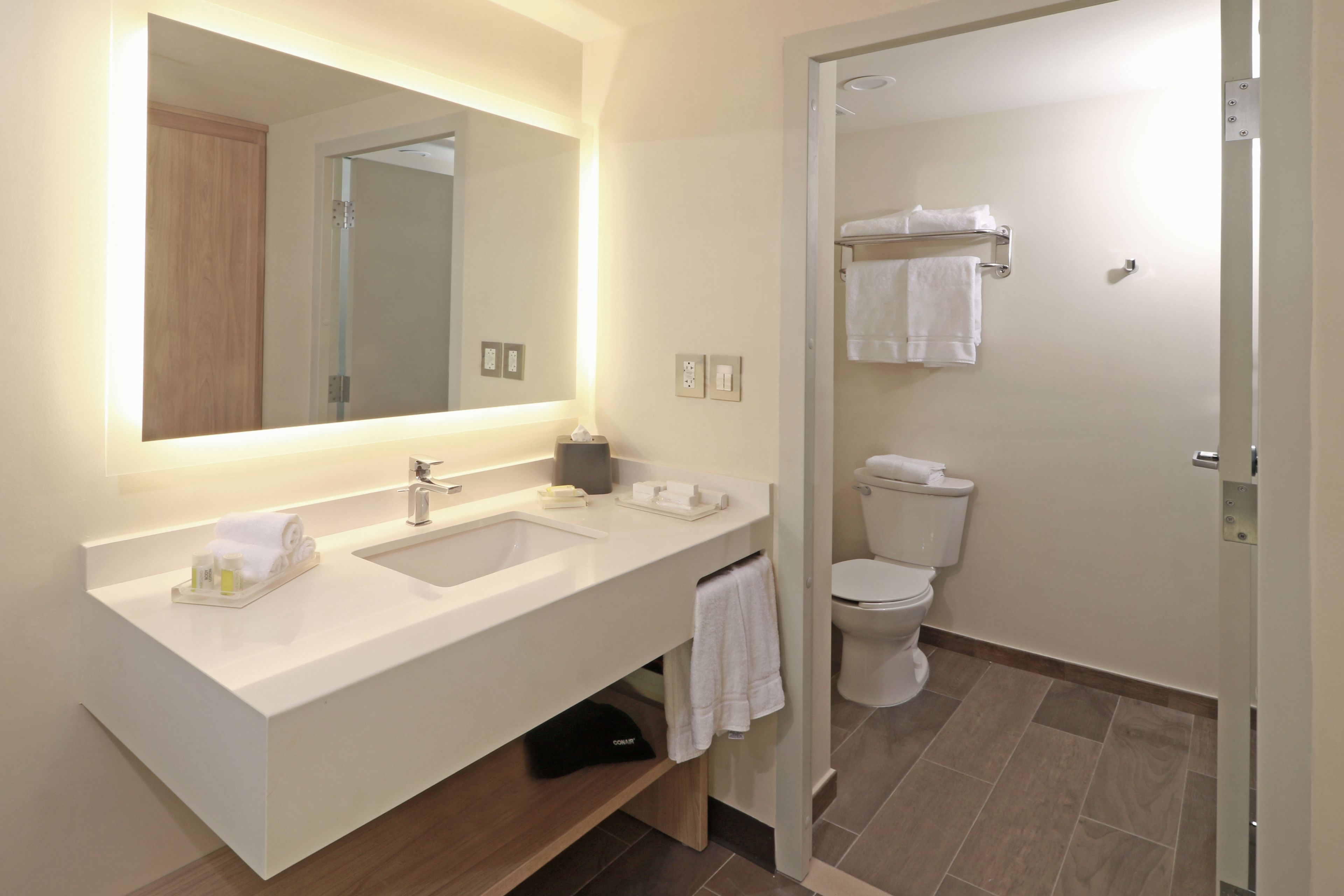 rainfall showerhead, hair dryer, towels, soap