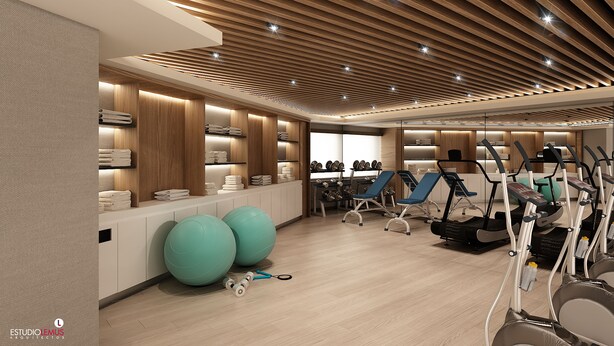 A modern gym with exercise equipment, weightlifting areas, and neatly arranged towels. - Holiday Inn Ciudad Juarez by IHG (Ciudad Juárez)
