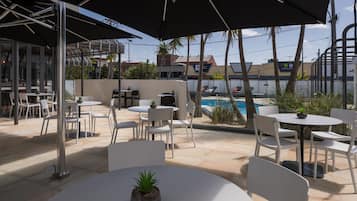 Outdoor pool, open 7:00 AM to 9:00 PM, pool loungers