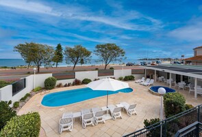 Outdoor pool, pool umbrellas, sun loungers
