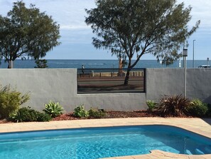 Outdoor pool, pool umbrellas, sun loungers