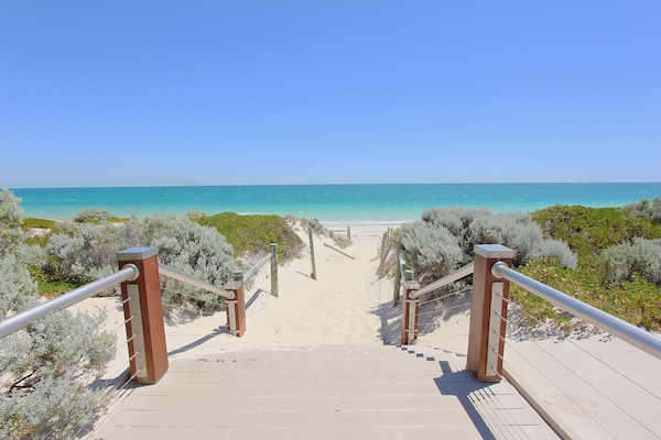 On the beach, white sand, beach towels