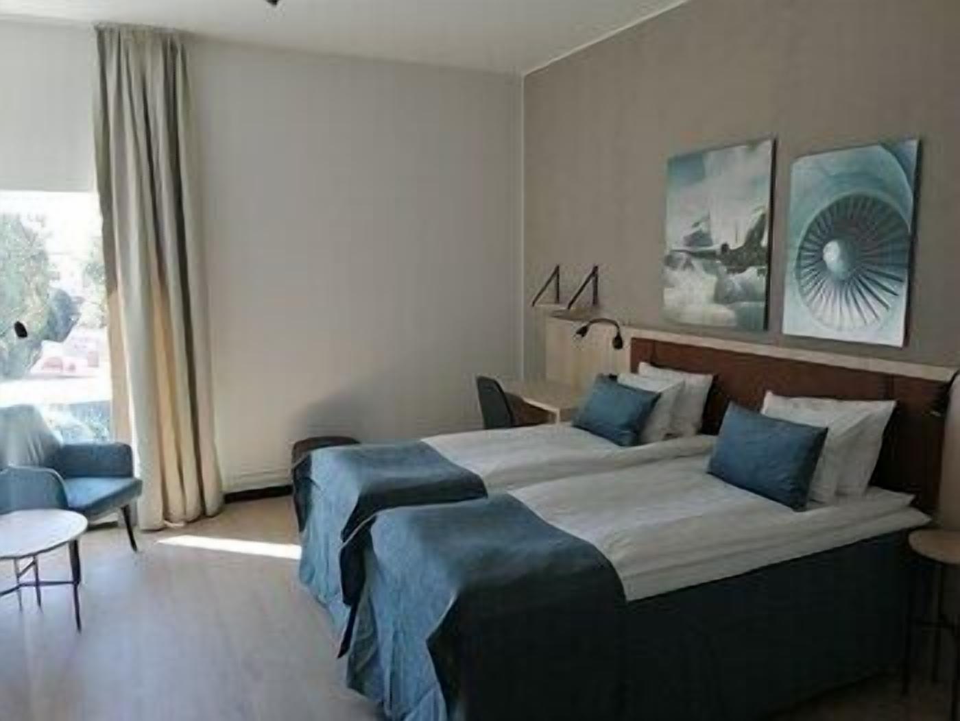 Hypo-allergenic bedding, desk, laptop workspace, blackout drapes