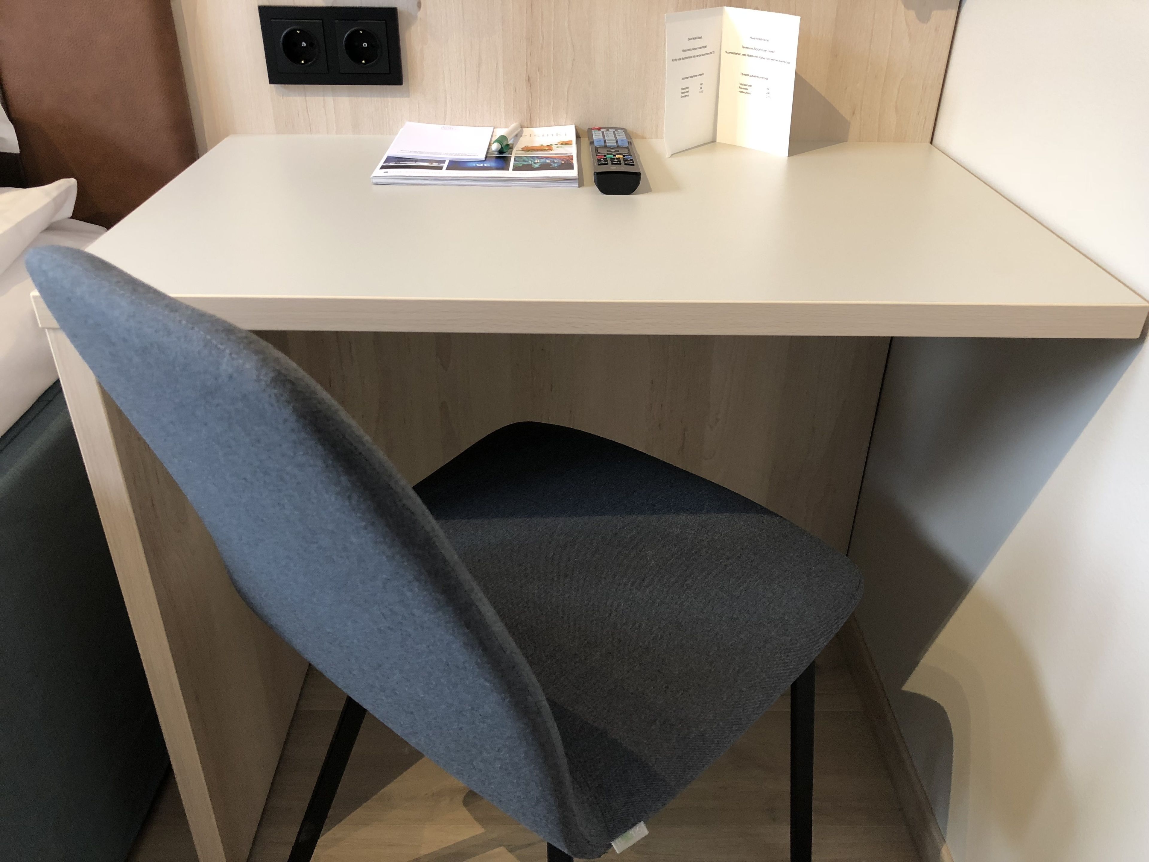 hypo-allergenic bedding, desk, laptop workspace, blackout curtains