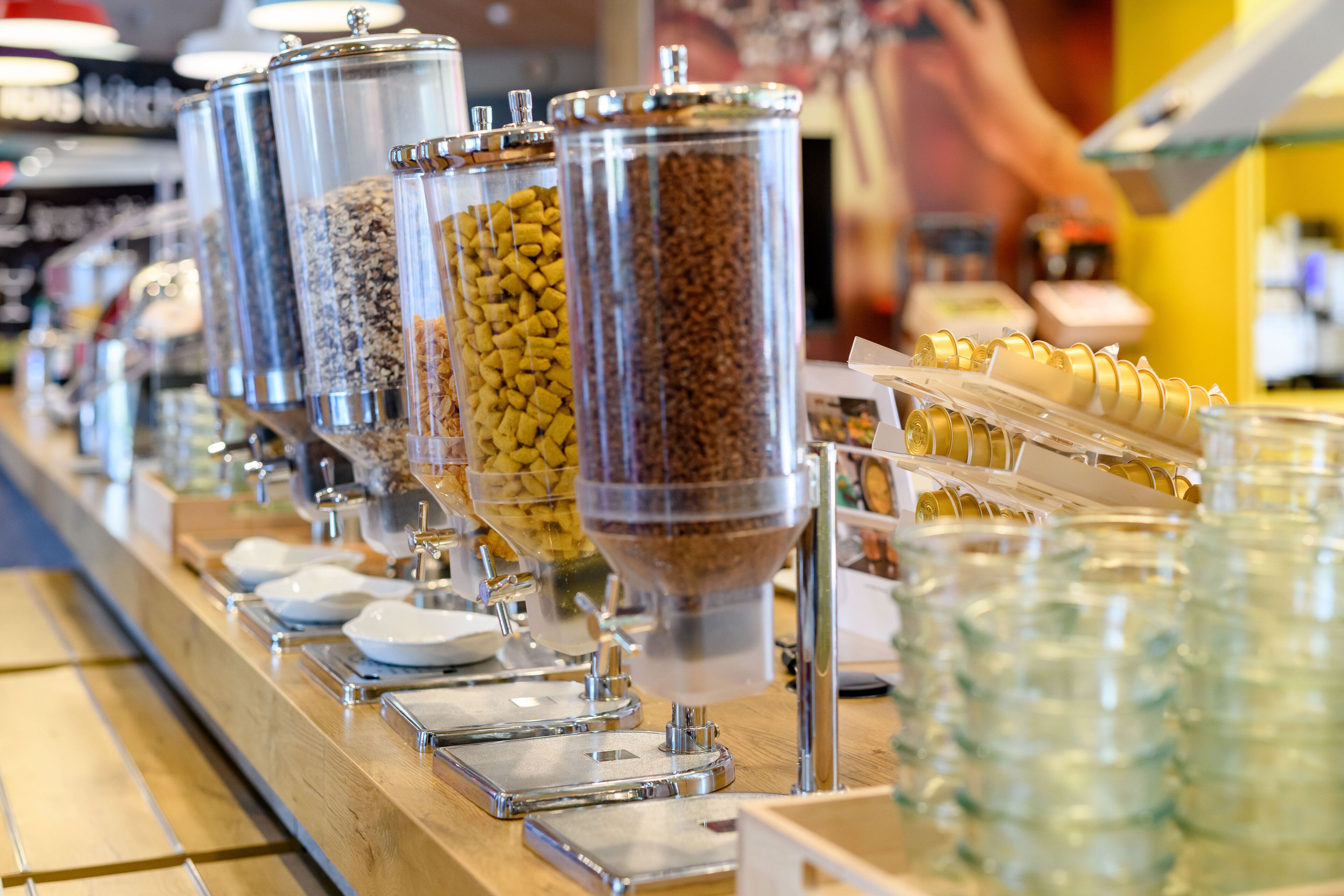 A buffet with various food dispensers and serving trays.