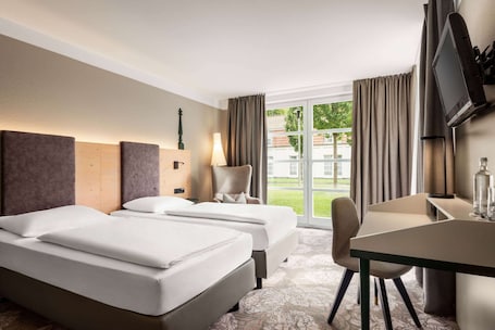 Comfort Room (Plus) | Premium bedding, desk, blackout drapes, iron/ironing board