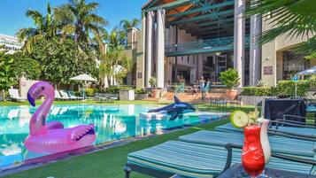 Outdoor pool, pool umbrellas, sun loungers