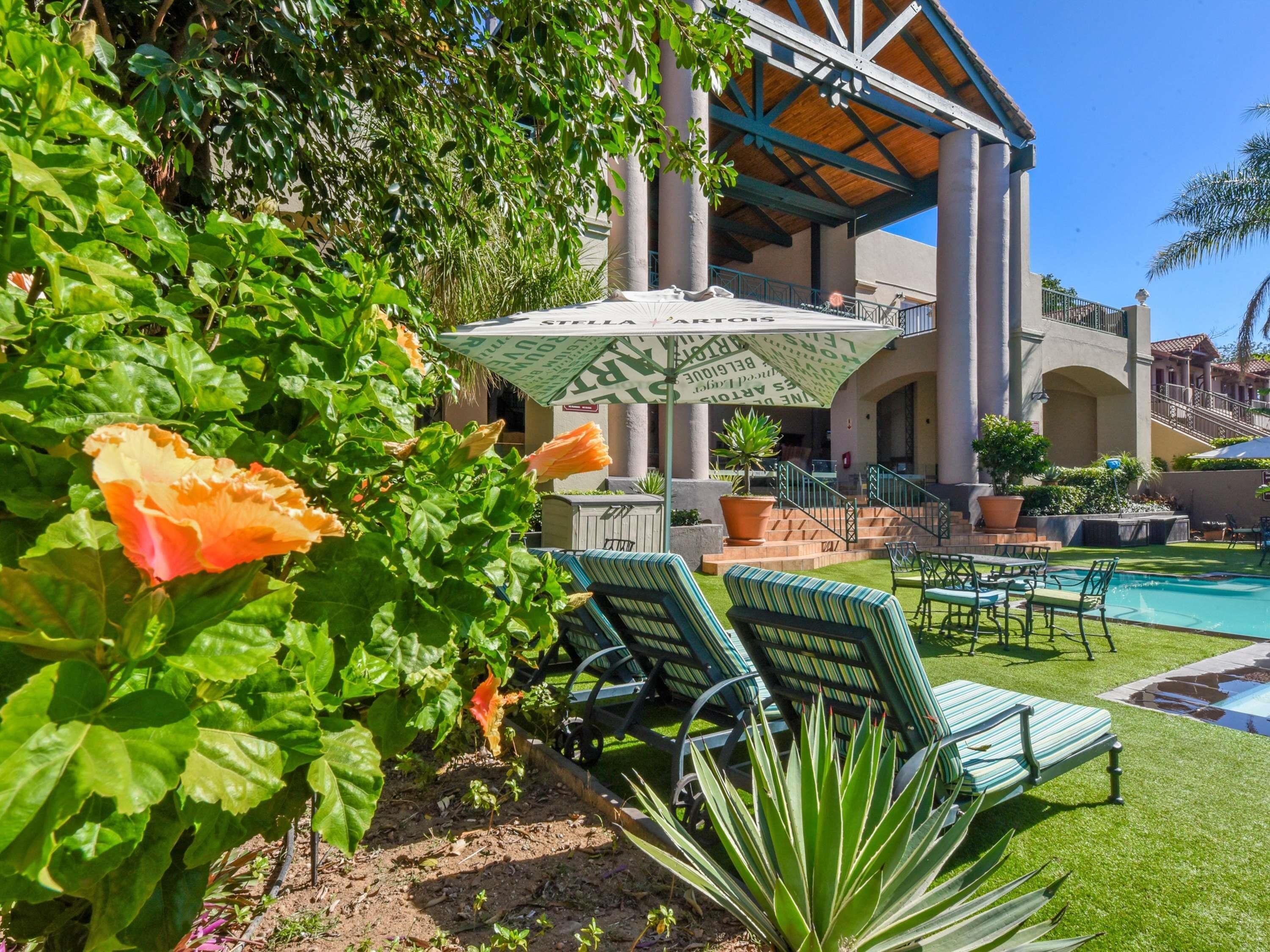 Outdoor pool, pool umbrellas, sun loungers