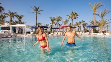 Indoor pool, outdoor pool, free pool cabanas, pool umbrellas