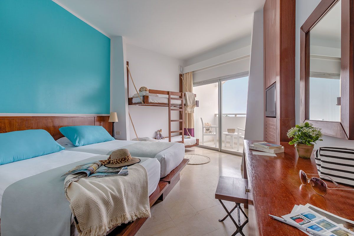 quadruple room | select comfort beds, minibar, in-room safe, desk