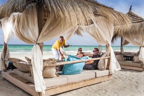 On the beach, sun loungers, beach umbrellas, beach towels