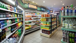 A grocery store with shelves stocked with beverages, snacks, and packaged goods. - Riviera by Isrotel Collection (Eilat)