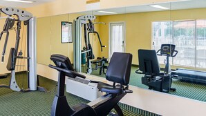 A gym with cardio equipment, a mirrored wall, and a treadmill. - Quality Inn Vicksburg (Vicksburg)