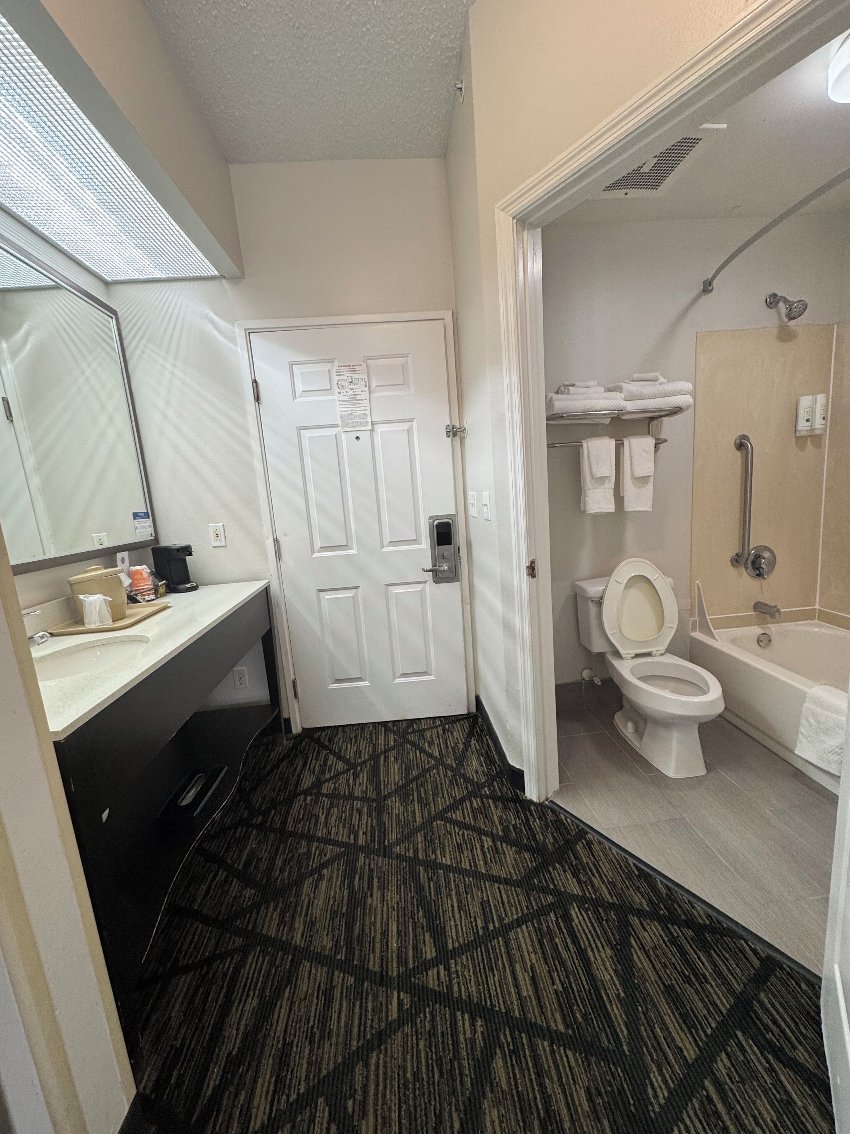 Combined shower/bathtub, rainfall showerhead, hair dryer, towels