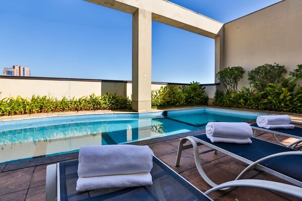 Outdoor pool, open 7 AM to 10 PM, sun loungers