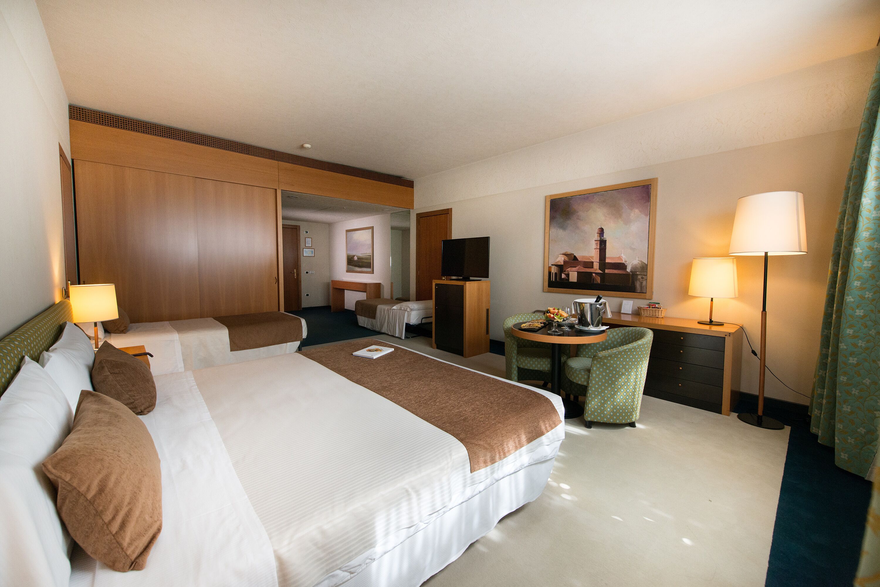 family room | premium bedding, minibar, in-room safe, desk