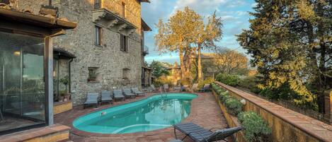 Seasonal outdoor pool, pool loungers