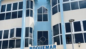 A building with a sign reading "BOQUEMAR" and a logo above the entrance. - Parador Boquemar (Cabo Rojo)